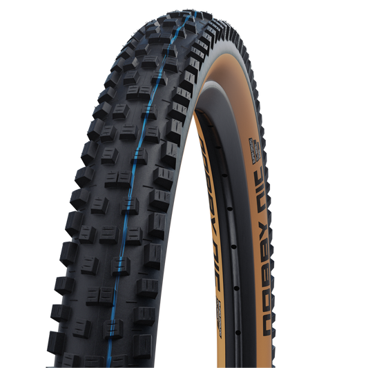 SCHWALBE NOBBY NIC 27.5x2.40 ADDIX SPEEDGRIP SUPERGROUND Snakeskin Tubeless Ready Zacht Zwart/Bruin band